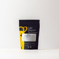 Lake Missoula Tea Company's KaPow! Ginkgo Brain Tea in a 2oz package, featuring ginkgo leaves and herbal ingredients for mental clarity.