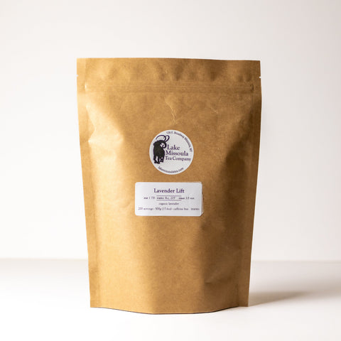 Lavender Lift tea by Lake Missoula Tea Company, 500g package featuring dried lavender flowers and tea leaves in a natural setting.