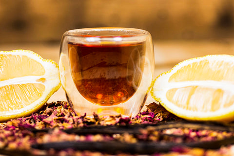 Lemon rose Puerh tea from Lake Missoula Tea Company, featuring a brewed cup with lemon slices and rose petals.