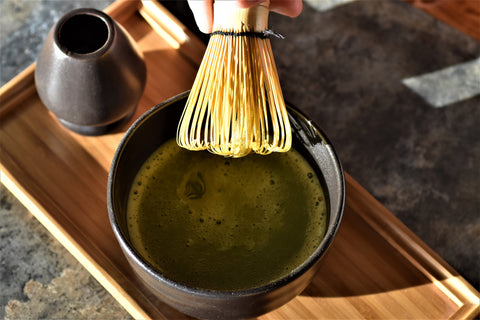 Lake Missoula Tea Company matcha whisk and tray in a bowl, showcasing traditional teaware for preparing matcha tea.
