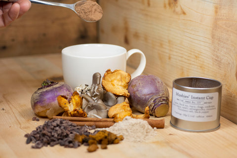 A cup of Mushies’ Instant Cup™ tea from Lake Missoula Tea Company with tea bag and steaming hot beverage in a cozy setting.