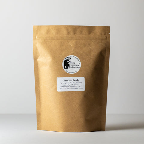 Lake Missoula Tea Company's Para Sara Peach tea in a 500g package, showcasing fresh peach-flavored tea leaves.