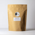 Pleistocene Peach tea by Lake Missoula Tea Company in a 500g package, featuring dried peach-flavored tea leaves.