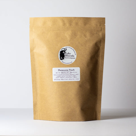 Pleistocene Peach tea by Lake Missoula Tea Company in a 500g package, featuring dried peach-flavored tea leaves.
