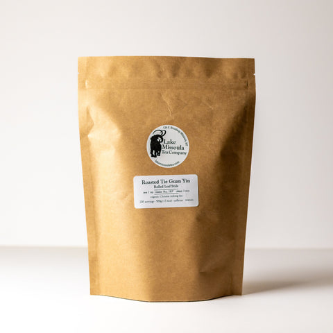 Roasted Tie Guan Yin tea leaves from Lake Missoula Tea Company, showcasing dark, rolled oolong tea in a 500g package.