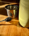 Roasted Tie Guan Yin tea leaves from Lake Missoula Tea Company, showcasing golden-brown roasted oolong tea in a bowl.