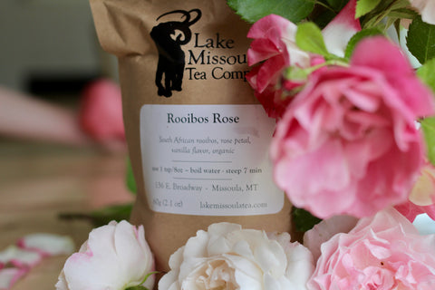 Cup of Rooibos Rose tea from Lake Missoula Tea Company, featuring a steaming mug of herbal tea with rose petals.