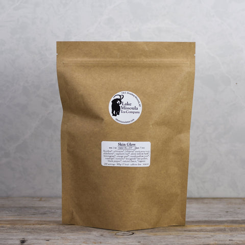 Lake Missoula Tea Company's Skin Glow herbal tea in a 500g package, featuring a blend of natural ingredients for radiant skin.