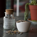 Jar of Lake Missoula Tea Company's "A Few of My Favorite Things" dark tea blend, with tea leaves and aroma visible in the image.