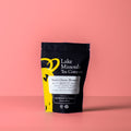 Two-ounce package of Lake Missoula Tea Company's Sweet Cherry Blossom herbal tea with cherry blossom imagery on the label.