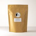 Lake Missoula Tea Company's Sweet Rhapsody tea in a 500g package, showcasing vibrant tea leaves and packaging details.