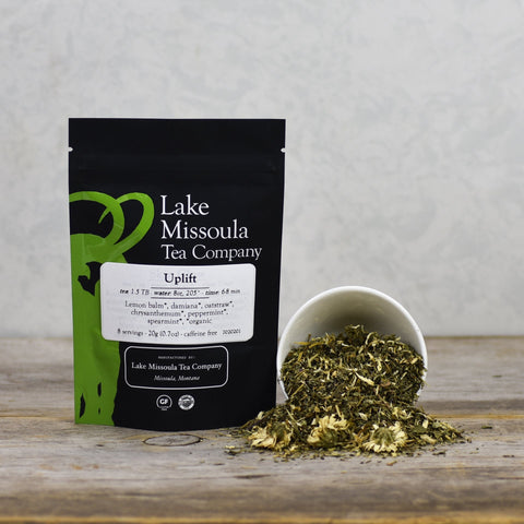 Two-ounce package of Lake Missoula Tea Company's Uplift herbal tea in a sealed bag with label.