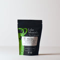 Two ounces of Who Chic herbal tea from Lake Missoula Tea Company in a resealable bag with colorful packaging.