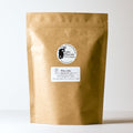 Lake Missoula Tea Company Who Chic herbal tea in a 500g package, featuring colorful, fresh tea leaves and herbs.