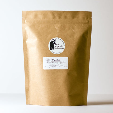 Lake Missoula Tea Company Who Chic herbal tea in a 500g package, featuring colorful, fresh tea leaves and herbs.