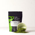 Yuzu Matcha Kuki Cha tea in a 2oz package from Lake Missoula Tea Company, featuring vibrant green tea leaves and citrus aroma