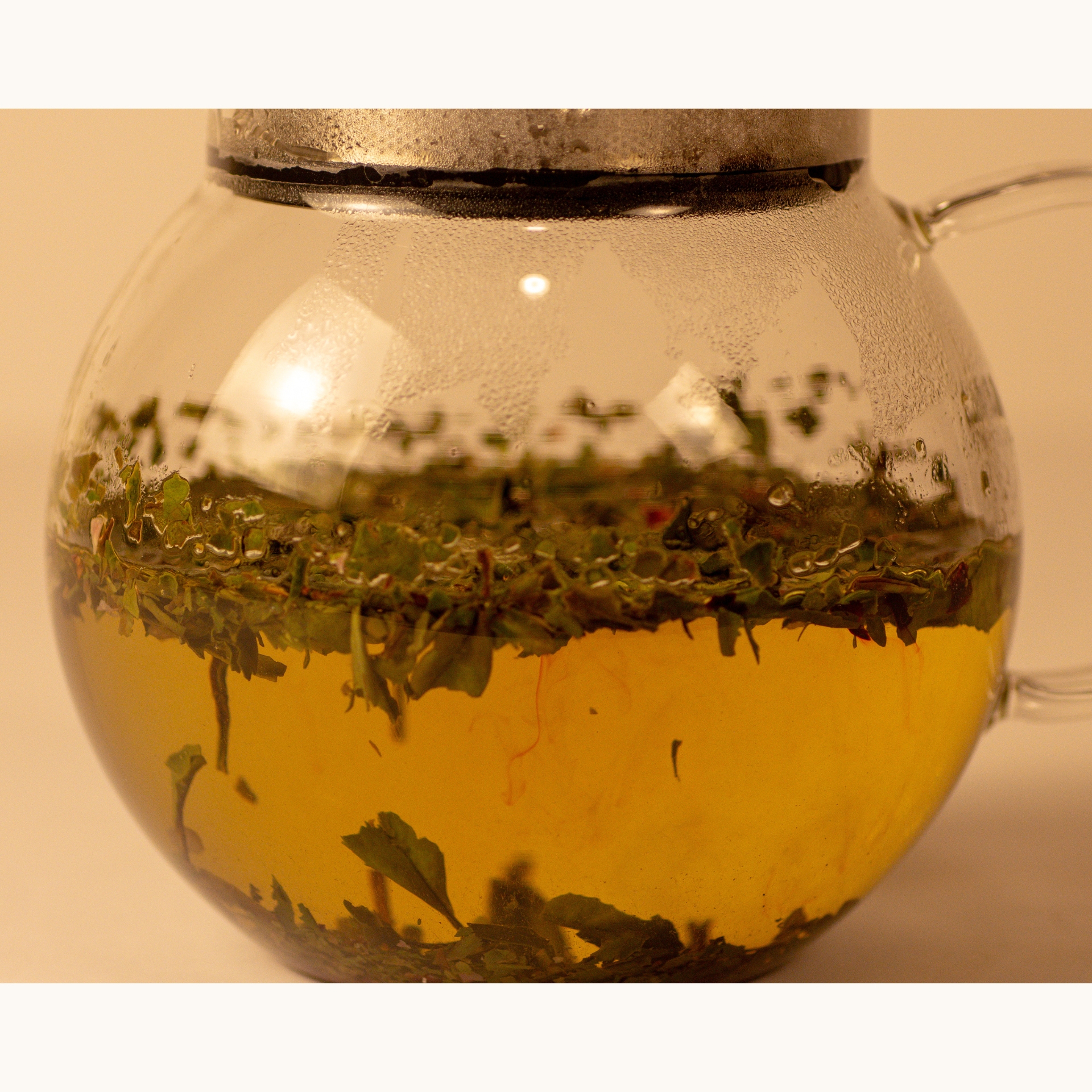 Sweet Cherry Blossom brewing in a glass teapot