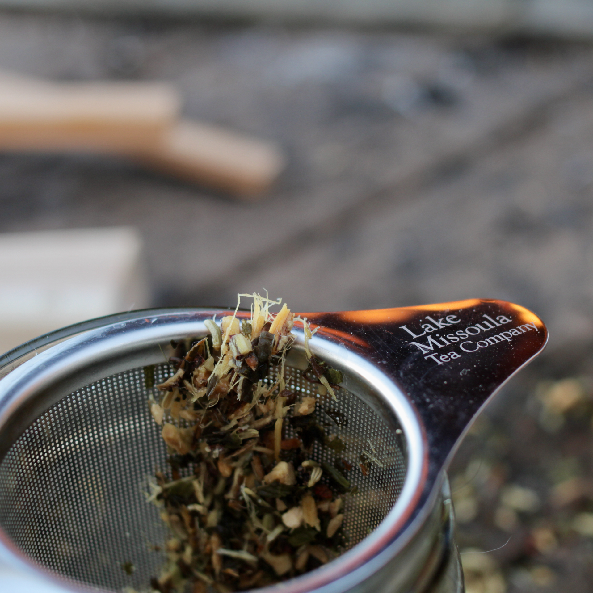 Brewing Licorice Mint in a stainless steel strainer